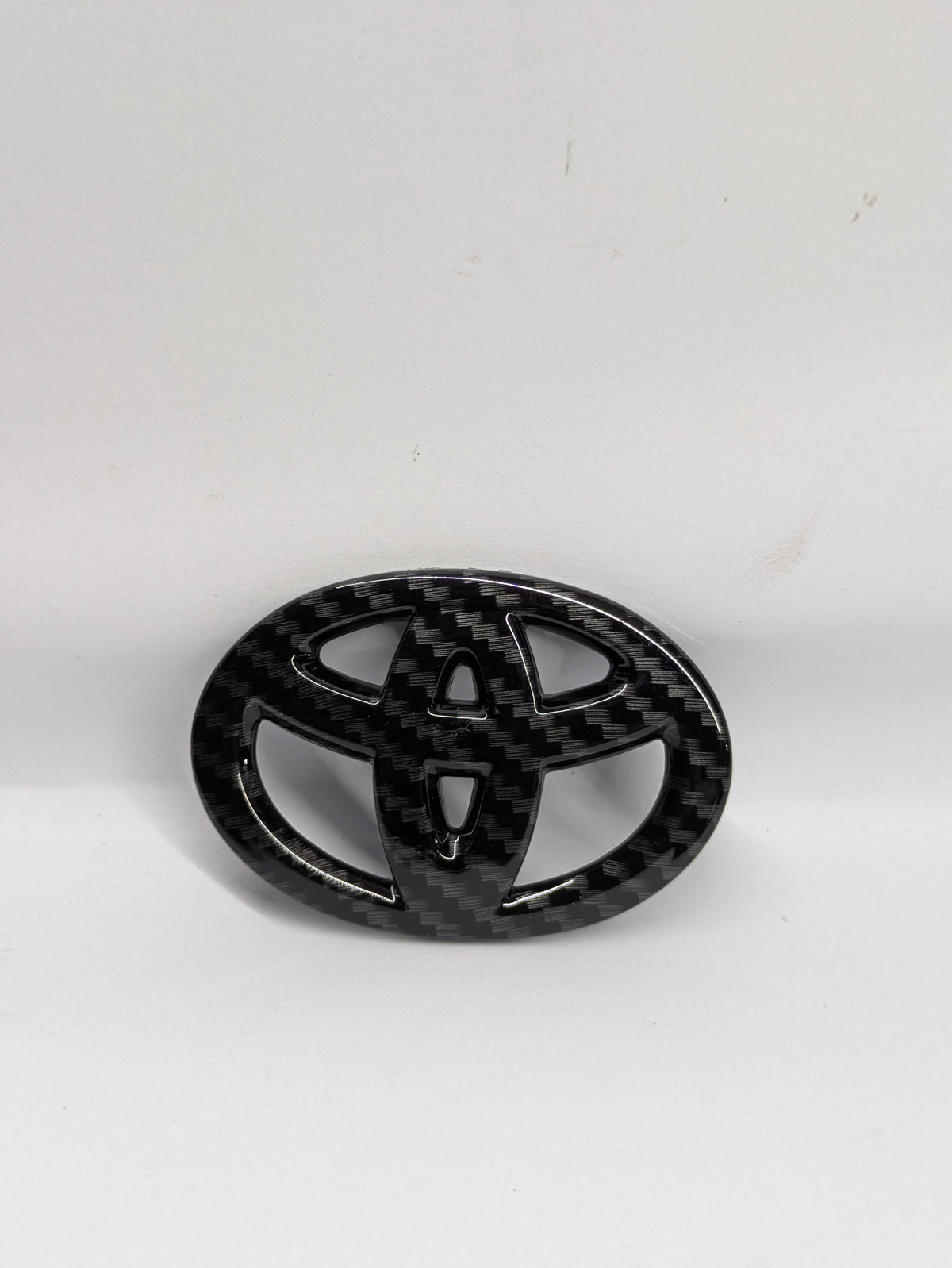 Toyota carbon steering logo